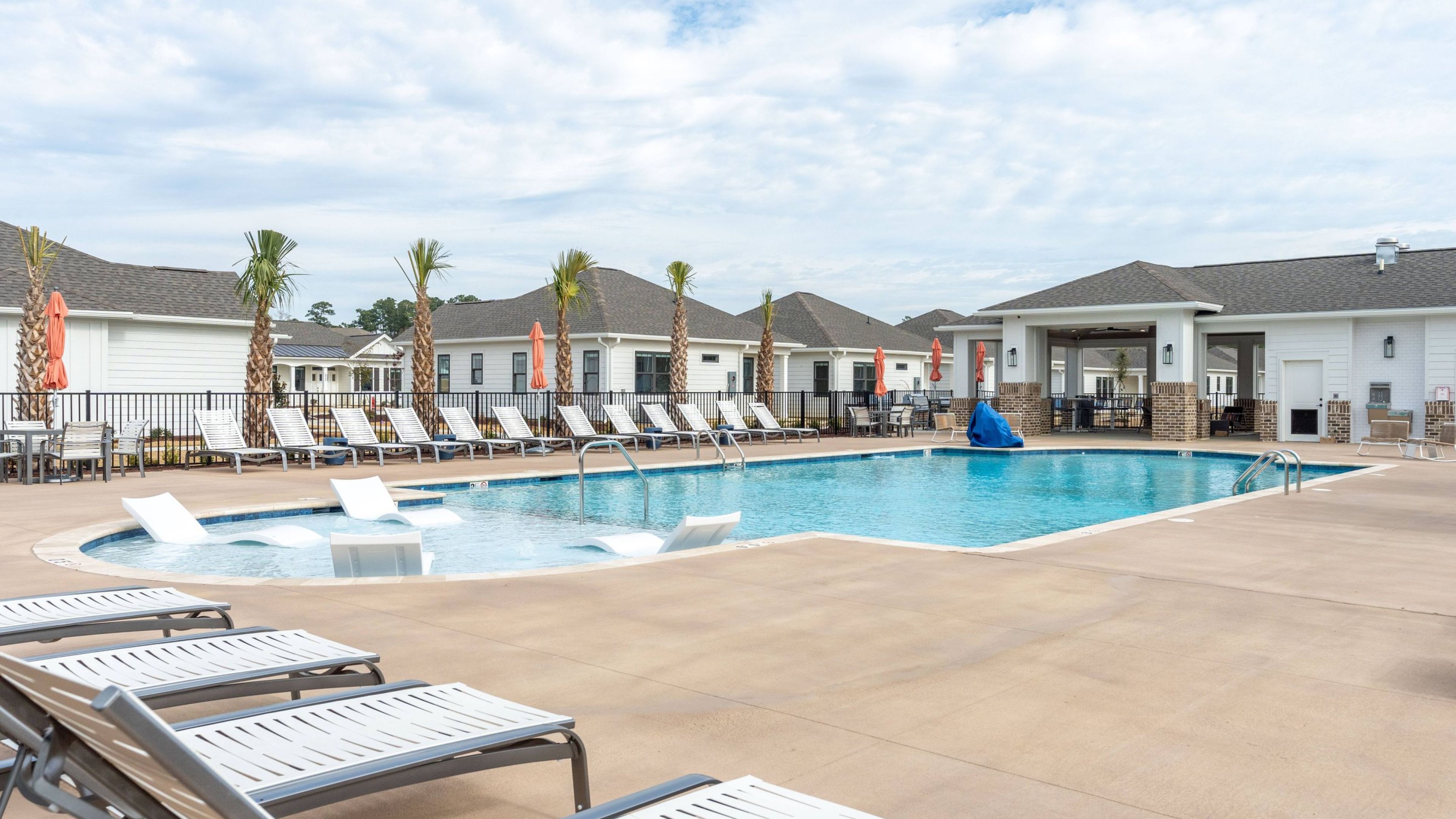 Hawthorne Cottages at Leland resort-style pool with in-pool lounge chairs